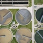 Aerial top view of round polls in wastewater treatment plant, filtration of dirty or sewage water. High quality photo