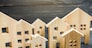 City of wooden figurines of houses. Buying and selling real estate. Renovation and home improvement. Mortgage loan. Building maintenance. Renting housing, realtor services.
