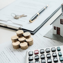 House model with real estate agent and customer discussing for contract to buy house, insurance or loan real estate background.