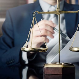 Weight scale of justice, lawyer in background. lawyer law justice judge scales courtroom legal scale concept