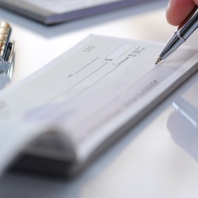 Prepare writing a check in office