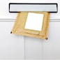 A padded envelope in the letterbox of a white front door, blank label for you to add your own name and address.