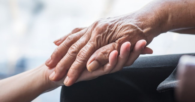 Parkinson disease patient, elderly senior person in support of nursing family caregiver for disability awareness day concept