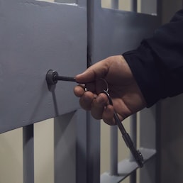 The door of a prison or detention center. Background