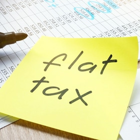 Memo with flat tax on an office table.