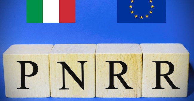 Italian flag and european flag with the sign "Pnrr", concept of european financial help