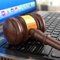 Online internet auction. Gavel on laptop.  3d