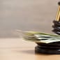 Law gavel on a stack of American money