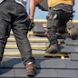 two carpenters working on the roof