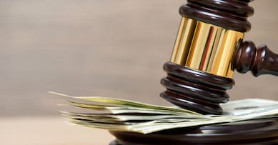 Law gavel on a stack of American money