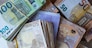 Bundles of European banknotes tied with rubber bands.