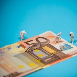 Specialists inspecting 50 euro banknote. Fraud concept. Macro photo