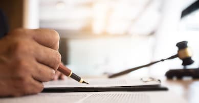 lawyer consultant with auction hammer at courtroom.