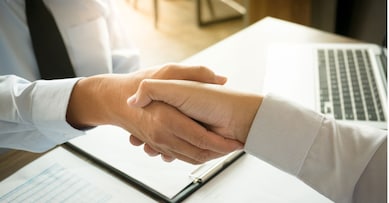 business negotiation in meeting hands shaking successful agreement