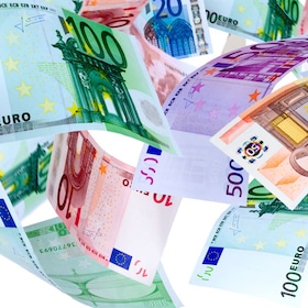 Panoramic image of falling Euro banknotes isolated on white