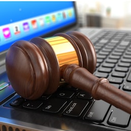 Online internet auction. Gavel on laptop. 3d