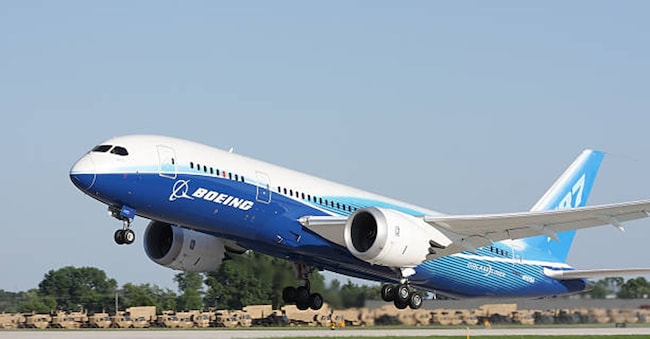 "Oshkosh, WI, USA - July 29, 2011: Brand new Boeing 787 Dreamliner in factory paint scheme taking off during EAA Airventure 2011."