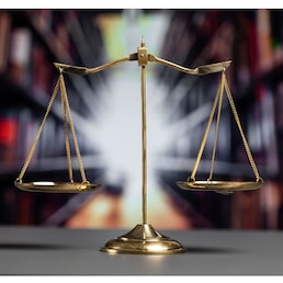 Shiny golden balanced scale in court library background as concept justice and fairness legal symbol. Scale balance for righteous and equality judgment by lawyer and attorney. equility