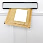 A padded envelope in the letterbox of a white front door, blank label for you to add your own name and address.