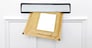 A padded envelope in the letterbox of a white front door, blank label for you to add your own name and address.