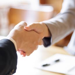 Business people shaking hands at a meeting