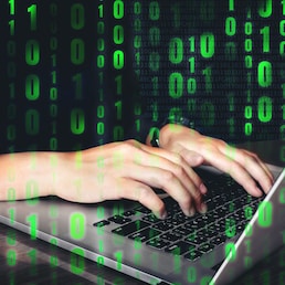 Hacker using keyboard typing bad data into computer online system and spreading to global stolen personal information. Cyber security concept