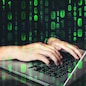 Hacker using keyboard typing bad data into computer online system and spreading to global stolen personal information. Cyber security concept