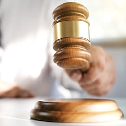 justice lawyer in a office , selected focus on hammer.