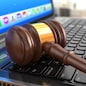 Online internet auction. Gavel on laptop.  3d