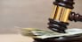 Law gavel on a stack of American money