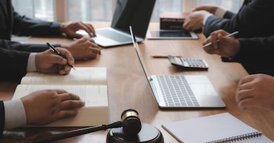 lawyer giving advice to business people. businessman discussing legal legislation at law firm. judge gavel & team meeting at courtroom