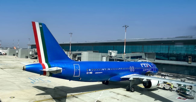 Rome, IT, July 13 2023: Airbus A320neo airplane operated by ITA Airways parked at the boarding area of Fiumicino Airport. Illustrative editorial. Transportation and travel