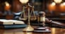 Close-up shot of the gavel on the judge's desk symbolizing court trials, justice, and legal decisions in the courtroom. The gavel and scales of justice representing law and justice concepts