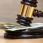 Law gavel on a stack of American money