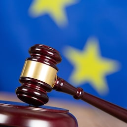 Judge hammer with European flag background