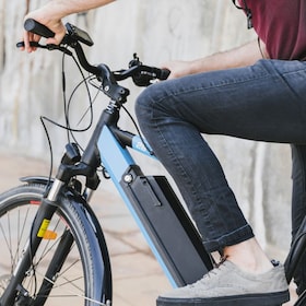 Close up man riding an e-bike