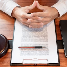 lawyer or judge business man working with paperwork agreement contract and gavel in Courtroom, Justice and Law firm Notary public concept.