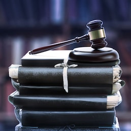 Stack of old paper folders and gavel