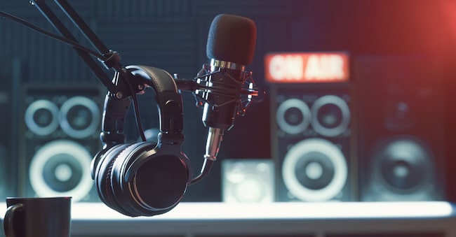 Professional microphone and headphones at the radio station, entertainment and communication concept