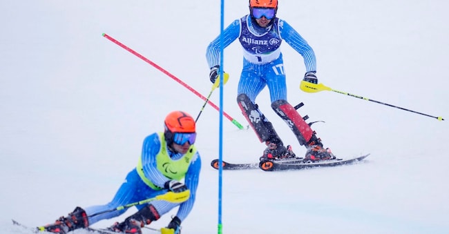 Paralimpiadi Milano Cortina 2026 - Sci alpino paralimpico - Slalom maschile per ipovedenti - Centro sciistico Tofane, Belluno, Italia - 15 marzo 2026. L'italiano Giacomo Bertagnolli e la guida italiana Andrea Ravelli in azione durante la prima manche REUTERS/Matteo Ciambelli