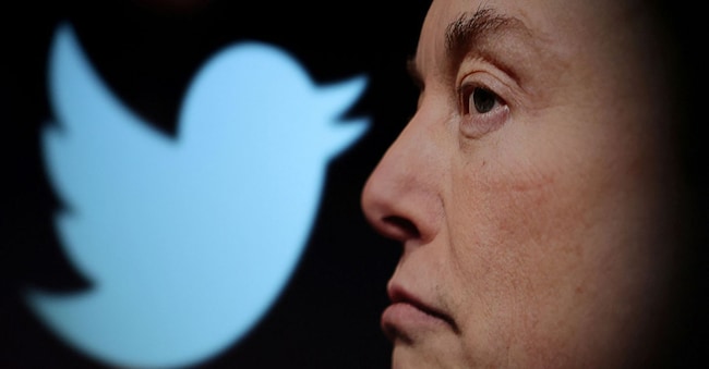 FOTO D'ARCHIVIO: Il logo di Twitter e una foto di Elon Musk sono visibili attraverso una lente d'ingrandimento in questa illustrazione scattata il 27 ottobre 2022. REUTERS/Dado Ruvic/Illustrazione/Foto d'archivio