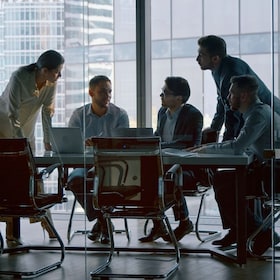 Corporate teamwork in the middle of a working day in a workplace meeting room AboutLife - stock.adobe.com