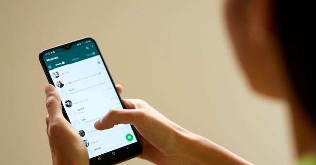2C8D7RG Girl using WhatsApp on her phone Alamy Stock Photo