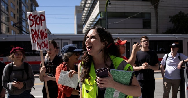 Protesters rally outside of the OpenAI headquarters before marching to the office of xAI, calling for a pause in AI development, in San Francisco, California, U.S., March 21, 2026. REUTERS/Manuel Orbegozo REUTERS
