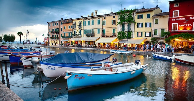 EFDR4G Low Angle View of Small Boats in the Harbor after Sunset, Lazise, Lake Garda, Veneto, Italy Alamy Stock Photo