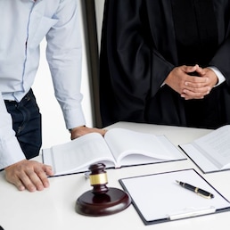 business people and lawyers discussing contract papers sitting at the table. Concepts of law, advice, legal services.