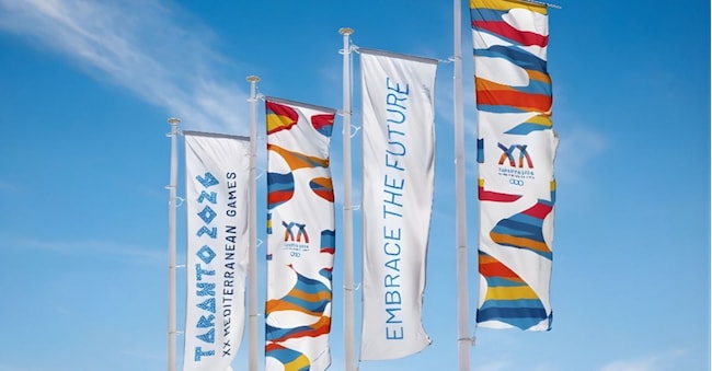 Il logo dei Giochi del Mediterraneo, che si terranno a Taranto nell’Estate del 2026 Casta Diva Group