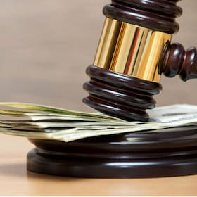 Law gavel on a stack of American money