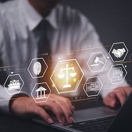 Businessman working laptop with a futuristic legal technology interface. Concept of law, justice, cybersecurity, digital transformation, and online legal services in business and corporate sectors.
