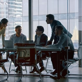 Corporate teamwork in the middle of a working day in a workplace meeting room AboutLife - stock.adobe.com